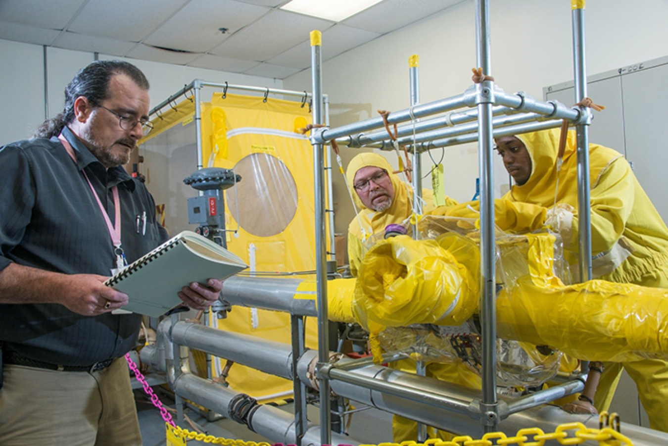 John Magruder (left) with Savannah River Nuclear Solutions (SRNS) Site Training instructs SRNS operators-in-training Marty Carroll and Sammie McDuffie.