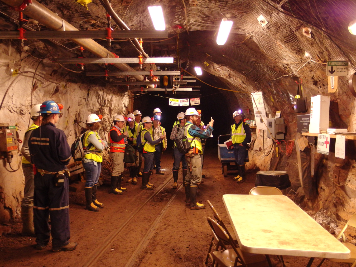 Visitors tour an underground mine