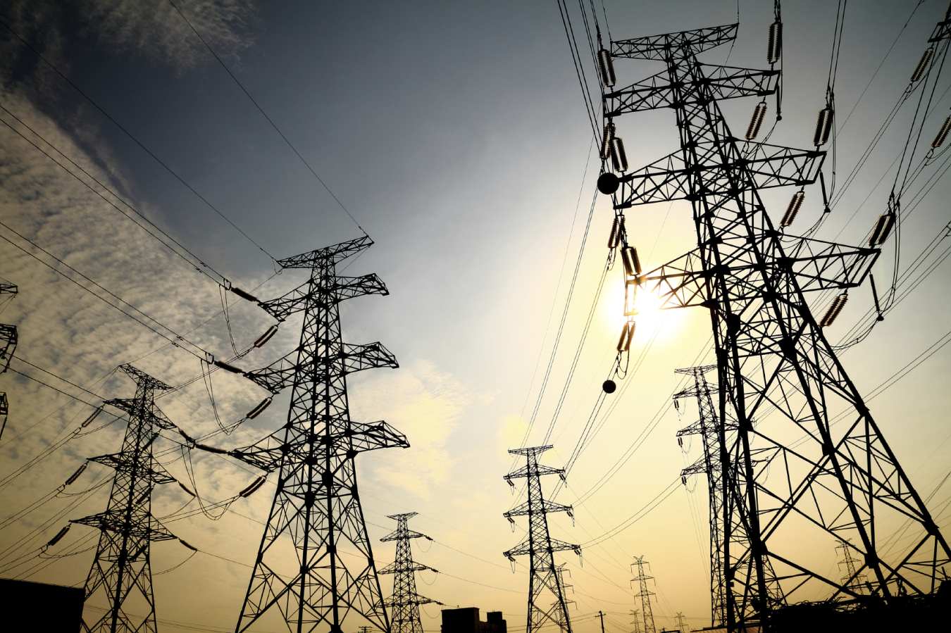 Power transmission towers against the sky.