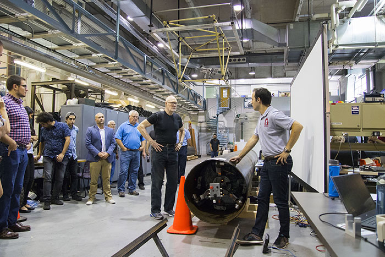 At right, Larry Papincak, a Carnegie Mellon University master's student in mechanical engineering, explains how PipeDream works to demonstration participants.