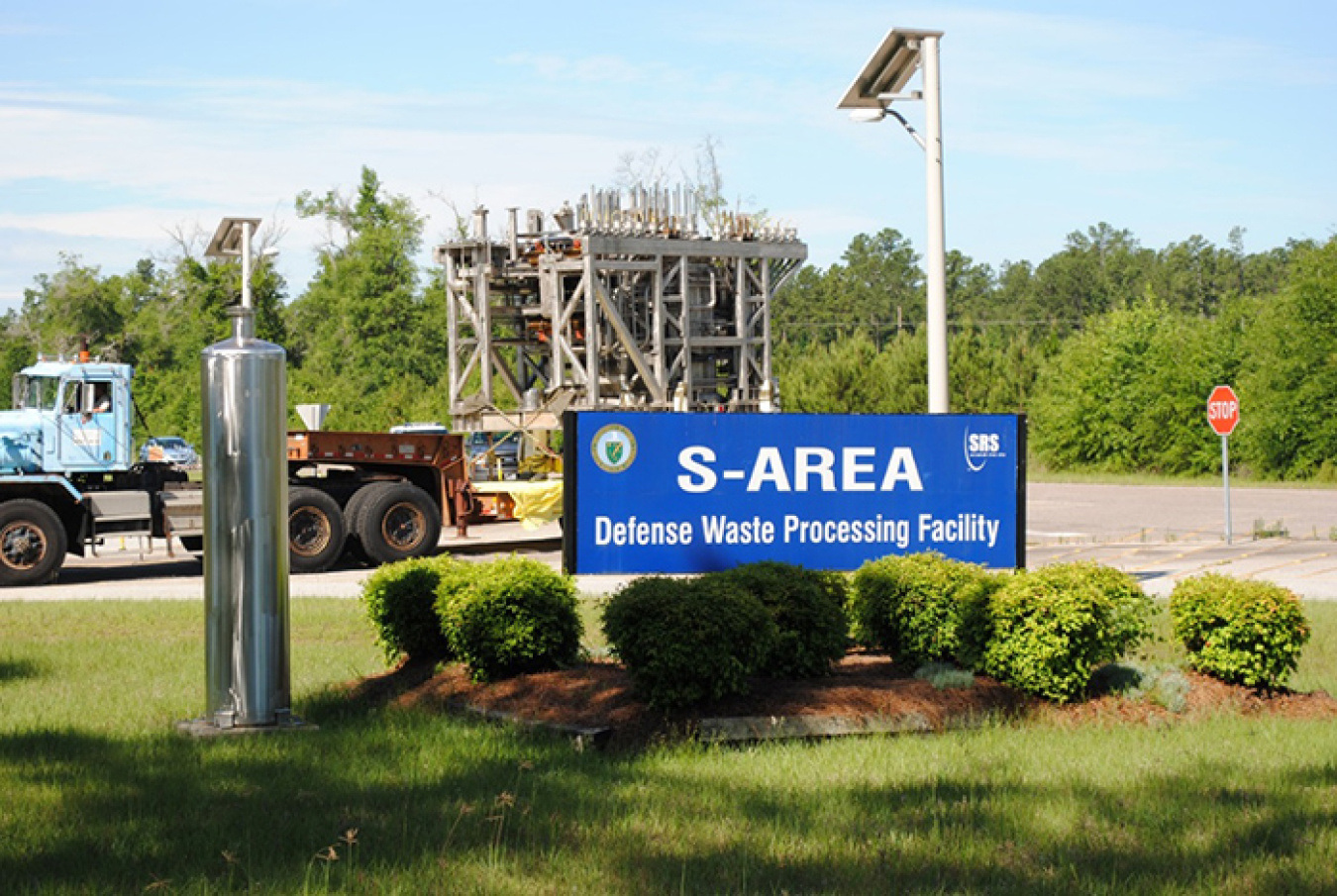 Melter 2 passes an empty canister on display at DWPF. Canisters like this one are used to store glassified radioactive waste.