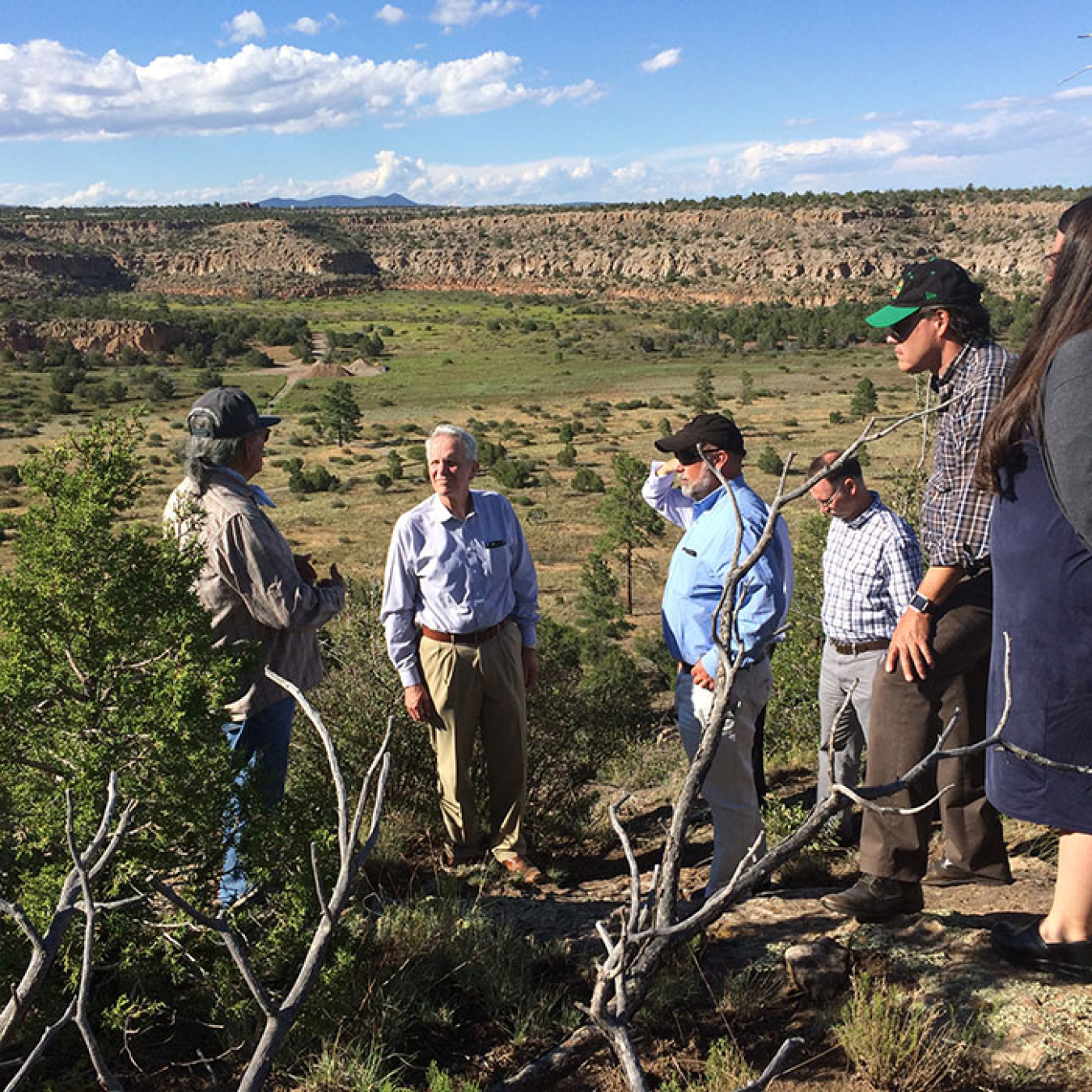 Left to right:  Tim Martinez, Jim Owendoff, Roger Jarrell, Rob Seifert, Mike Gardipe and Laura Mansfield. Los Alamos National Laboratory is in the background.