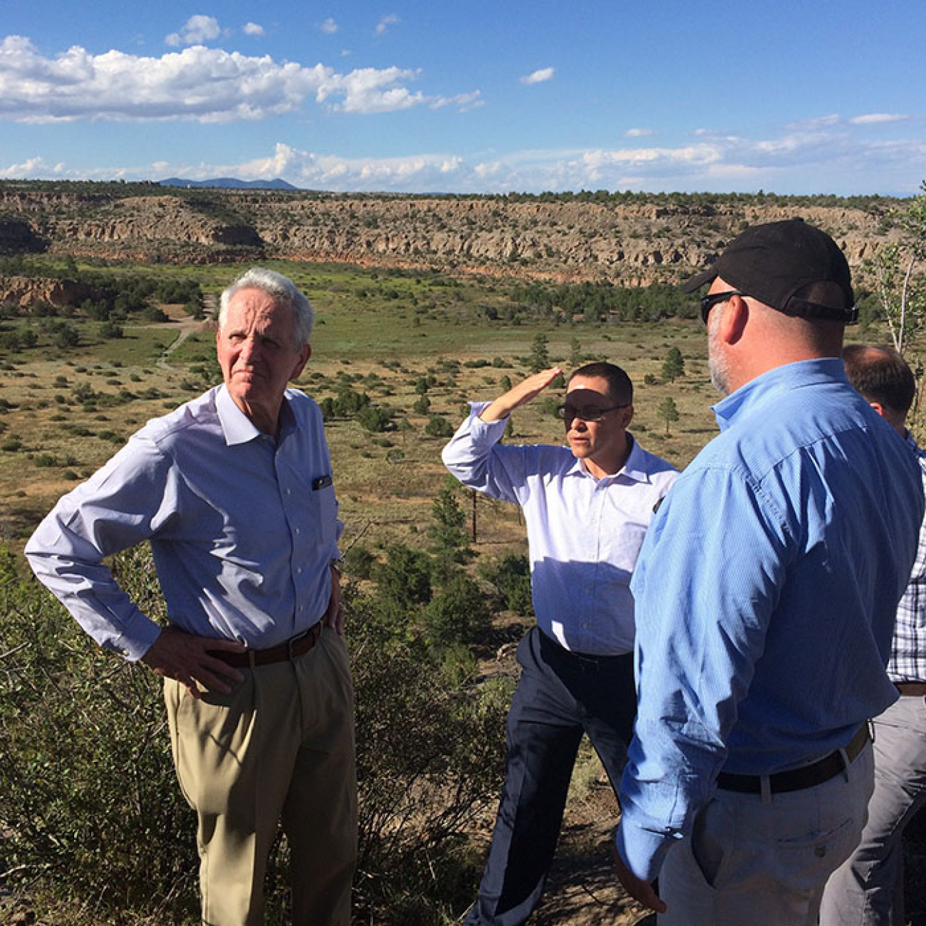 Acting EM Assistant Secretary Jim Owendoff, left, and Roger Jarrell, Senior Advisor to the Energy Secretary for EM, right, with San Ildefonso Pueblo Gov. James Mountain, center.