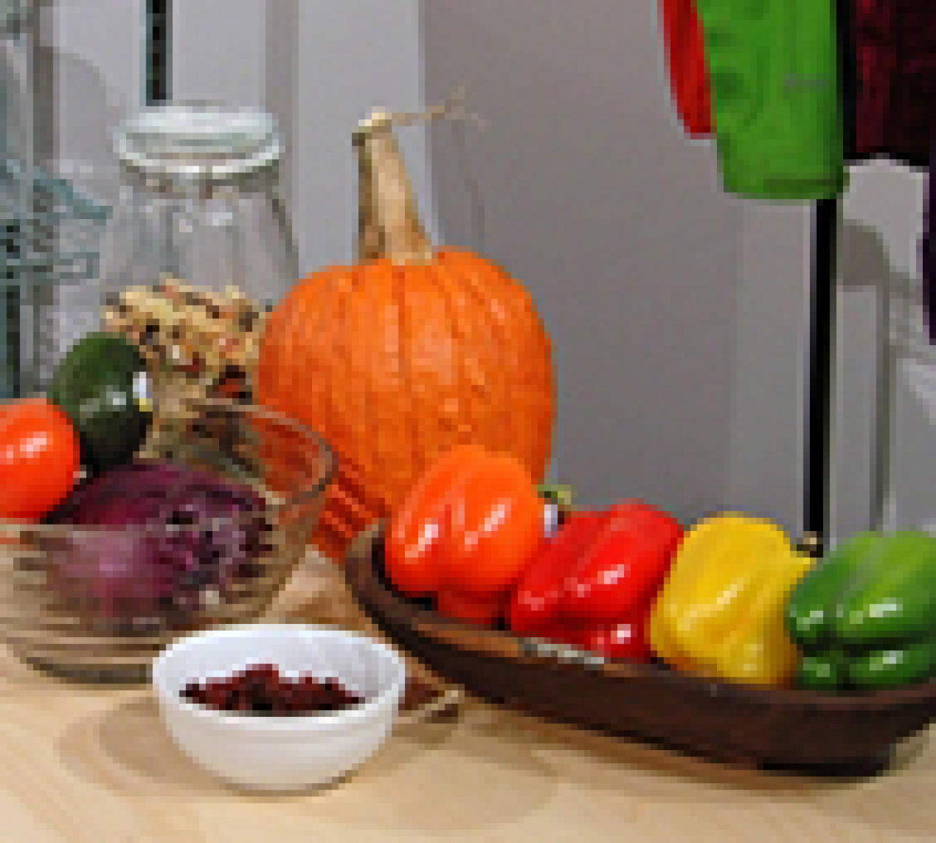 a photo of fruit and vegetables on a table displaying color under a LED light.
