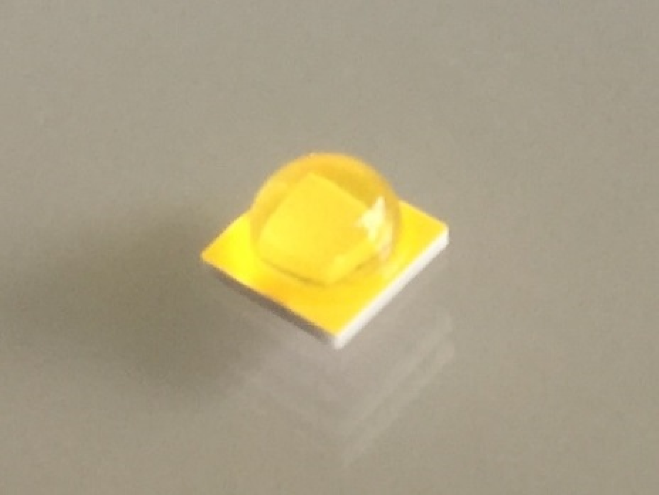 Prototype high-power LED sample showing an efficacy of 175 lm/W with a CCT of 4000K and a CRI of 70, at a junction temperature of 85° C and a current density of 35 A/cm2.