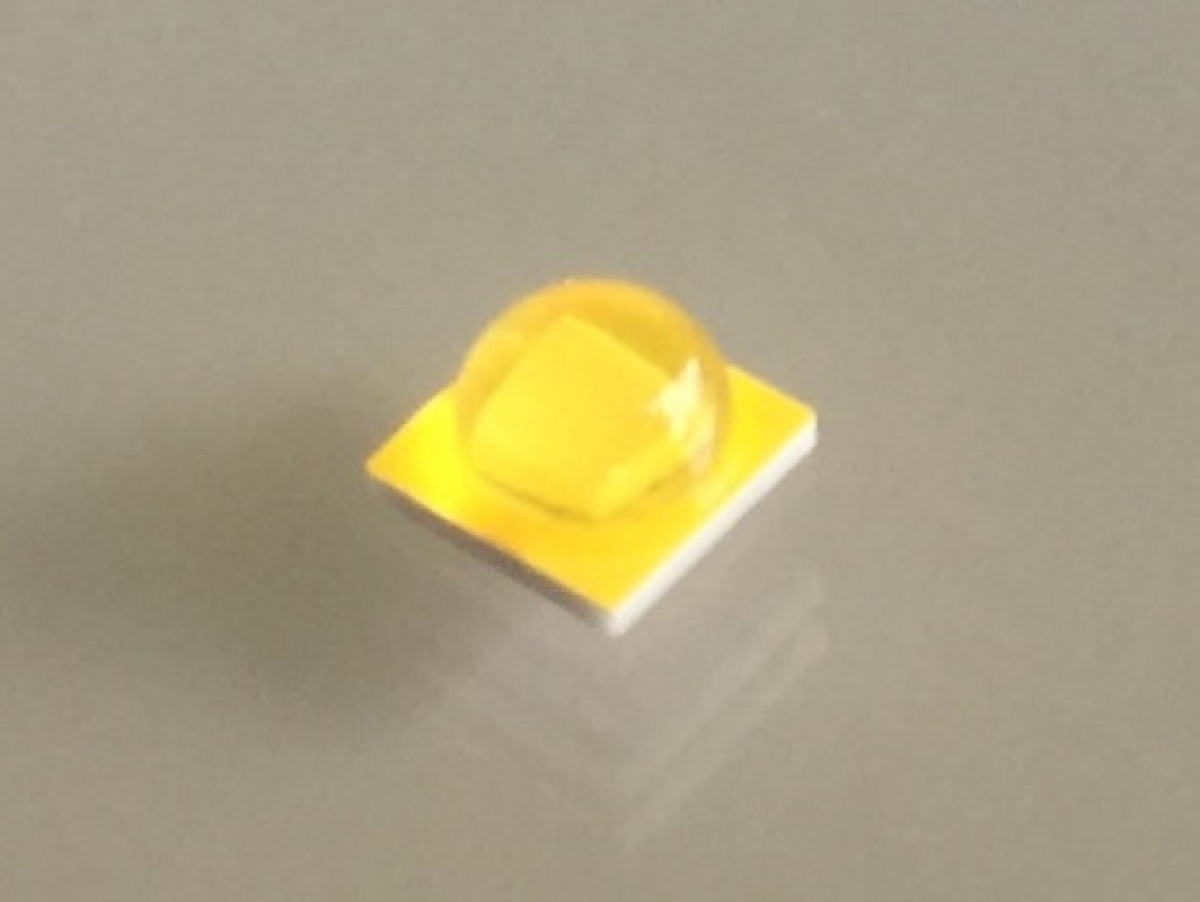 Prototype high-power LED sample showing an efficacy of 175 lm/W with a CCT of 4000K and a CRI of 70, at a junction temperature of 85° C and a current density of 35 A/cm2. 