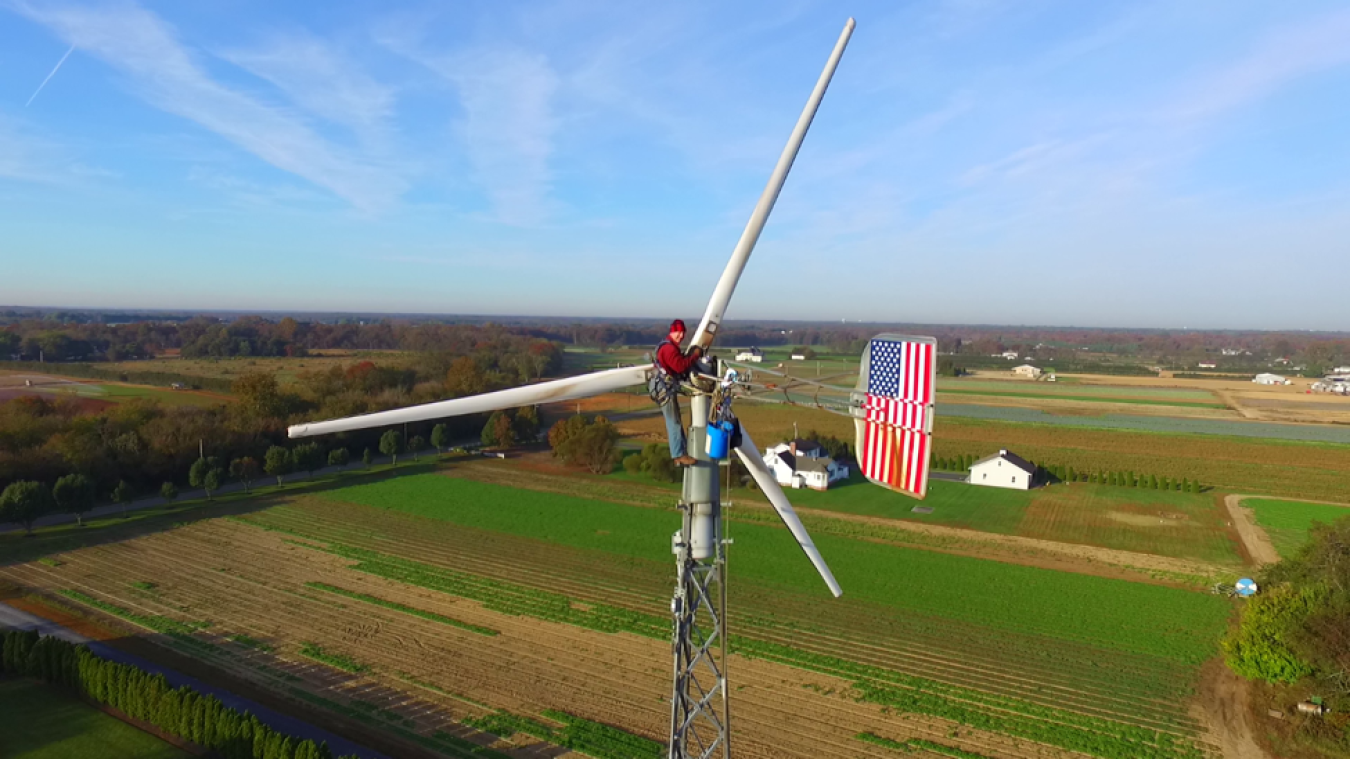 Technician working on a distributed wind turbine.