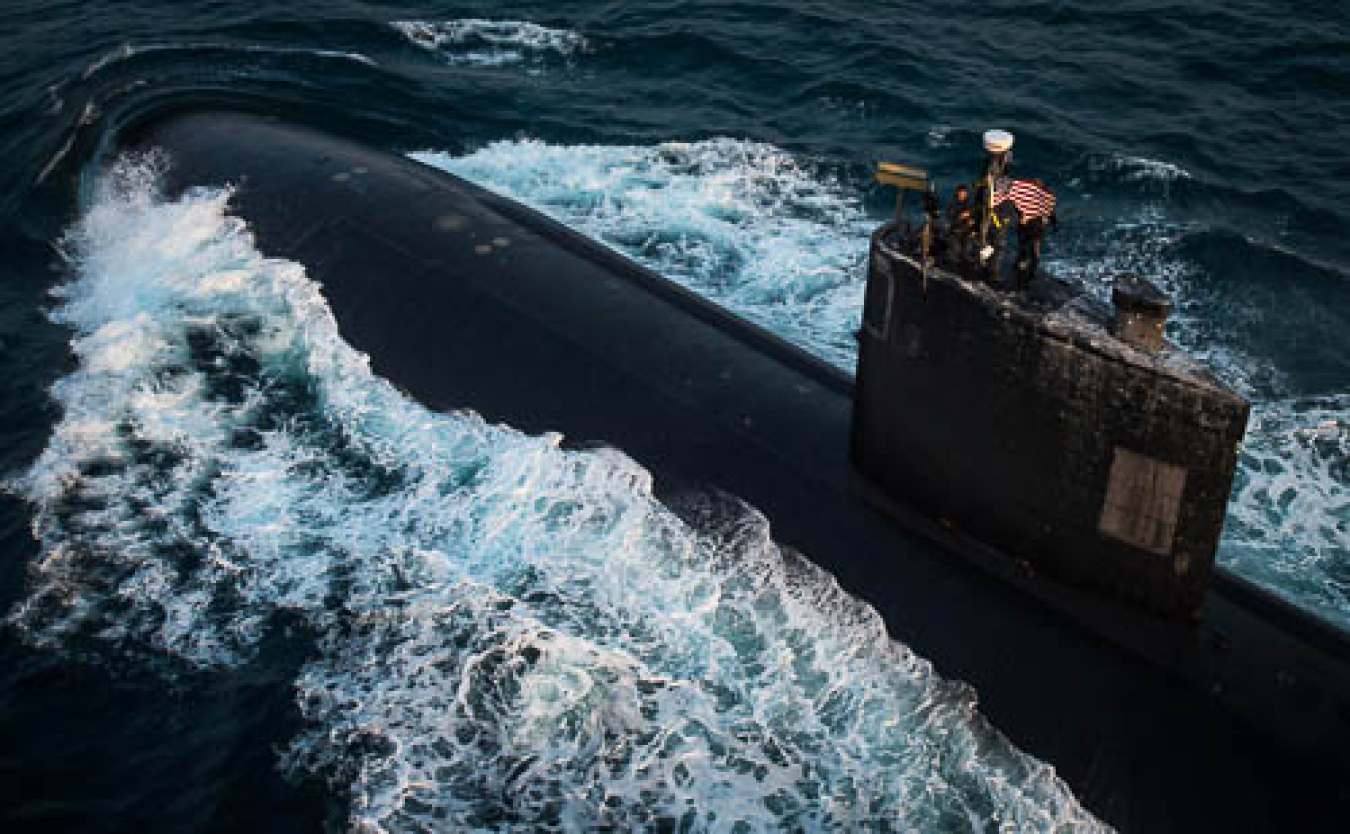 A U.S. Navy nuclear-powered sub steams ahead on the surface of the sea