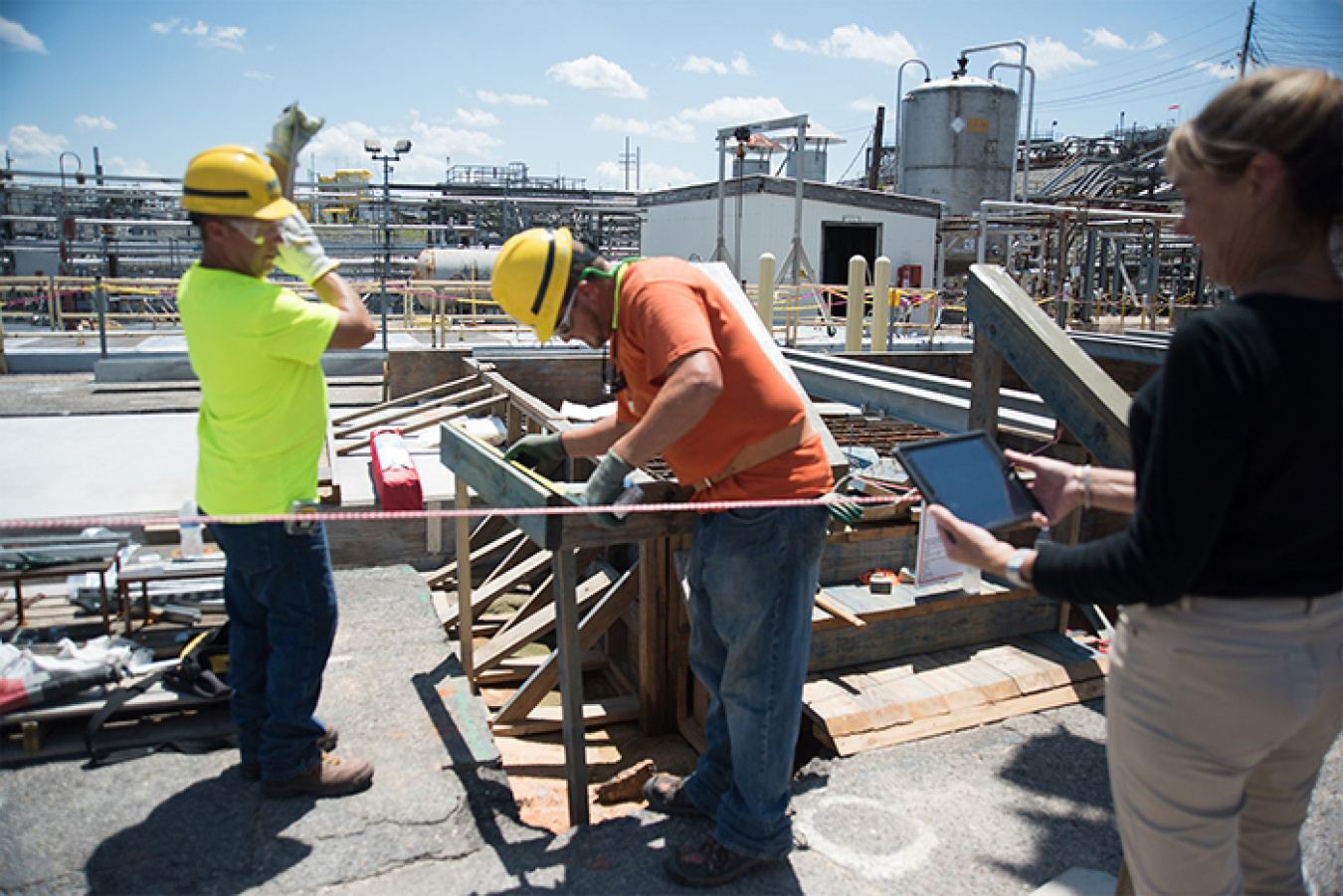 Savannah River Remediation Industrial Hygienist Sally Starling monitors two construction workers wearing physiological monitoring devices in the Savannah River Site Tank Farms.