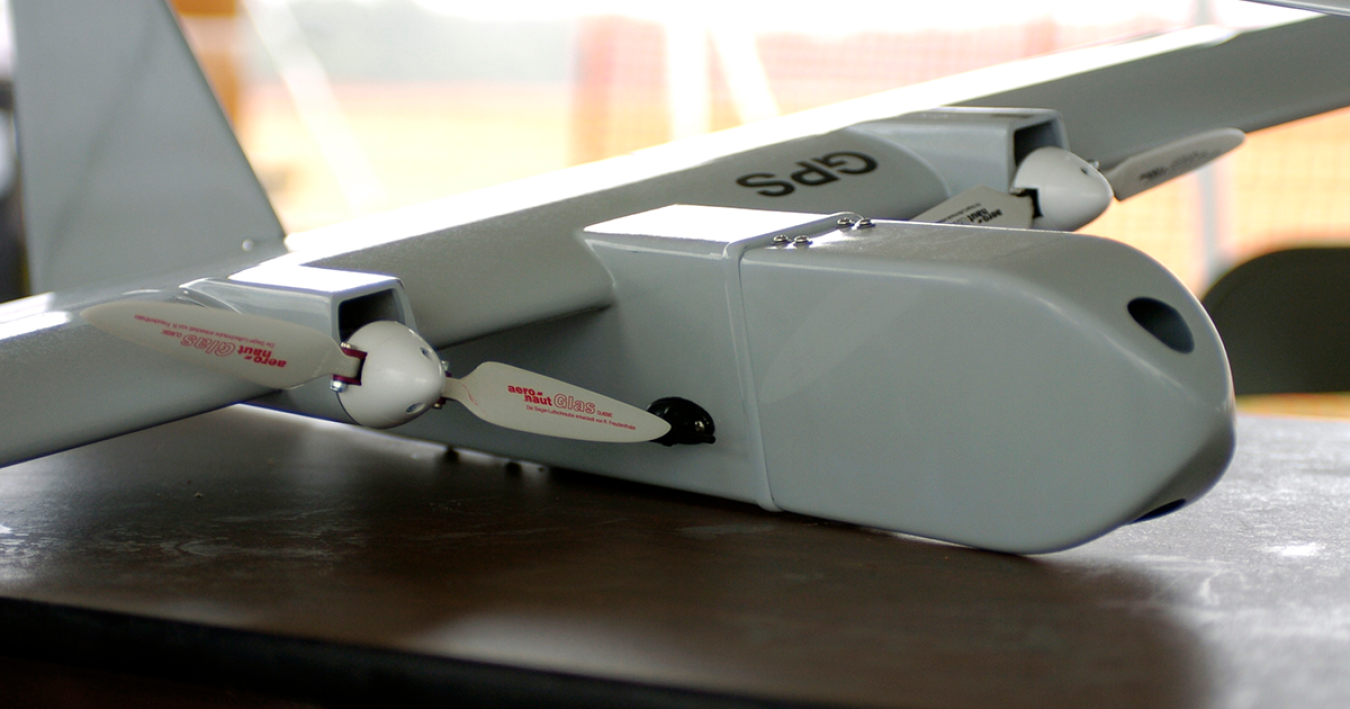 An unmanned aerial vehicle positioned on a table.