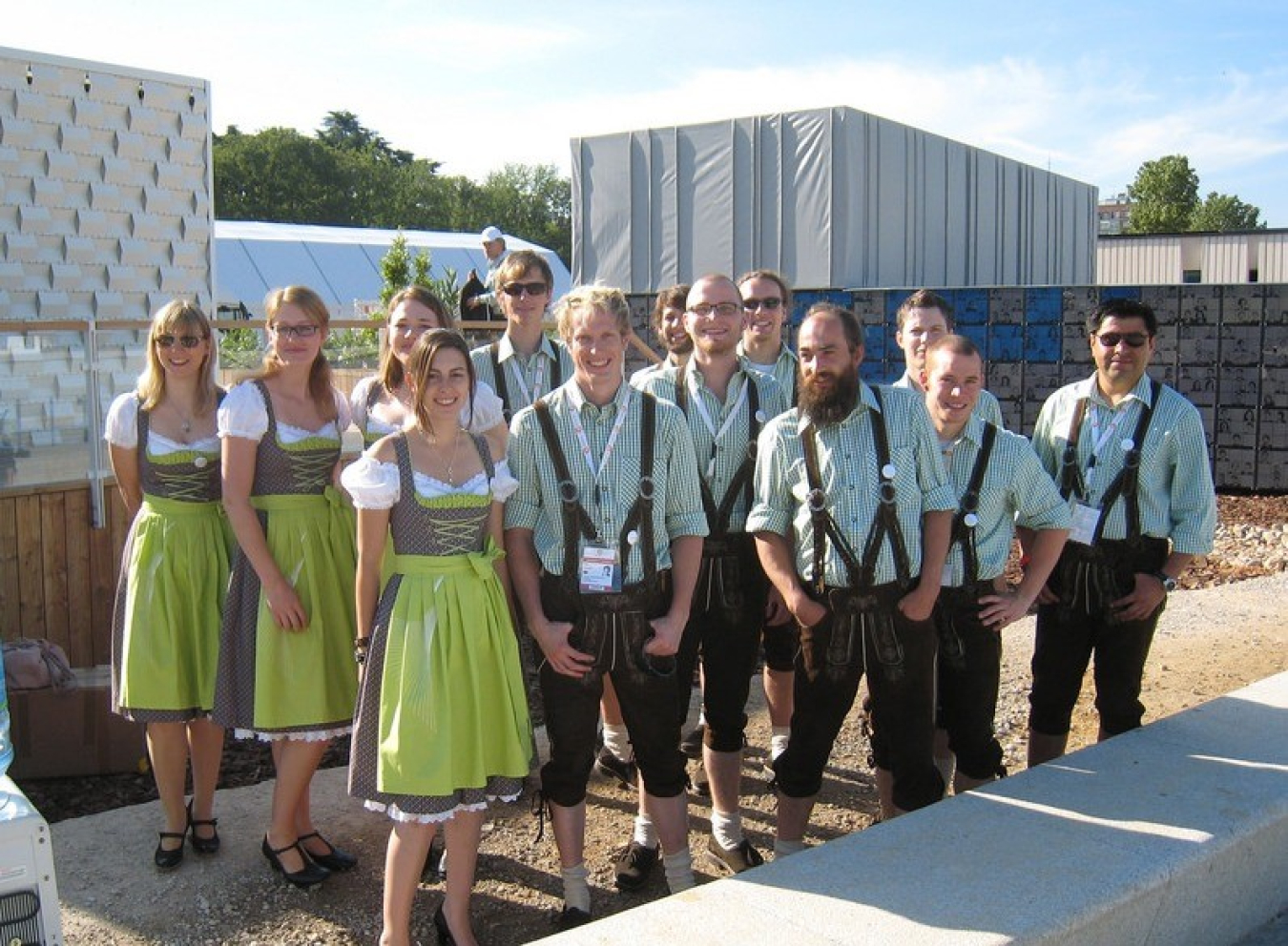 Students wearing lederhosen pose for a picture.