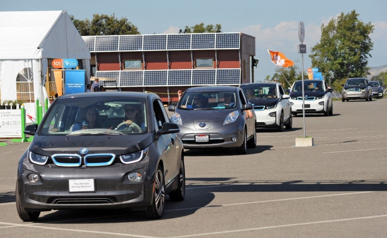 Electric cars lined up in a row.