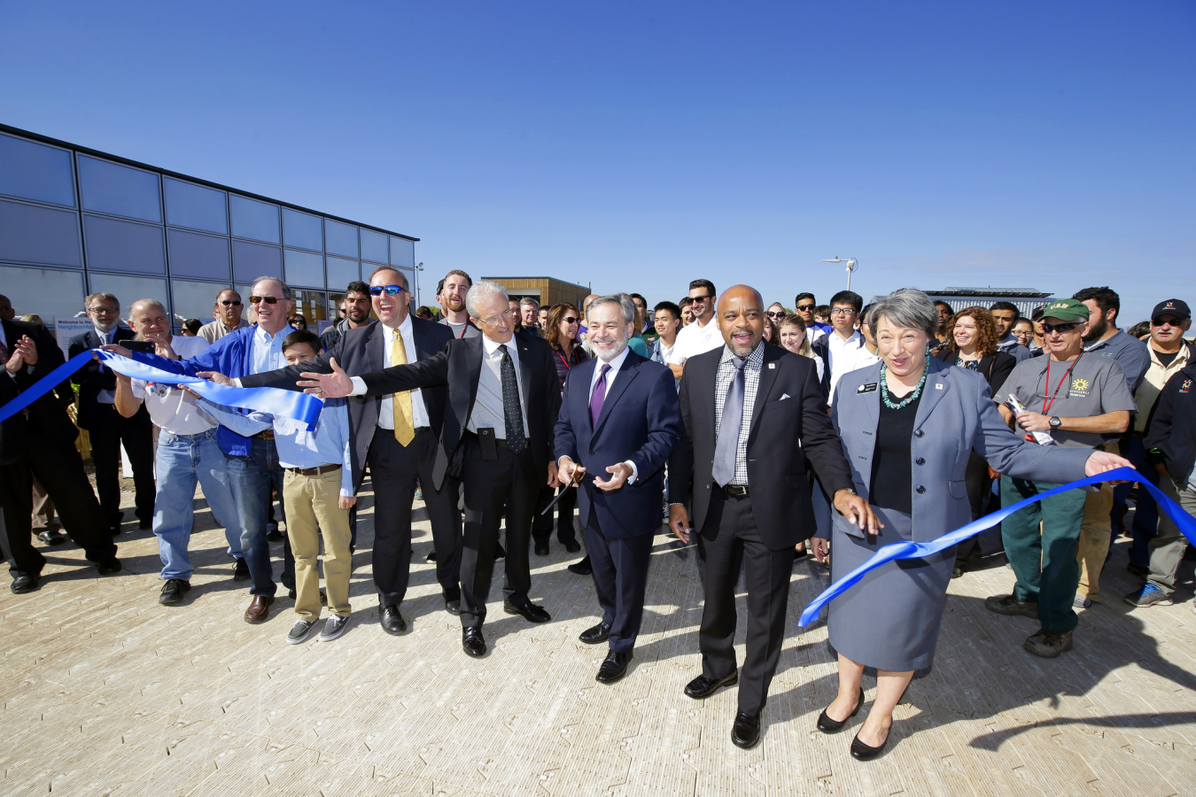 The ribbon-cutting to officially open the U.S. Department of Energy Solar Decathlon 2017 at the 61st & Peña Station in Denver, Colorado. (Left to right) Robert Dixon, Department of Energy, Maurice Guathier, CEO of VSE Corporation, Deputy Secretary of Ener