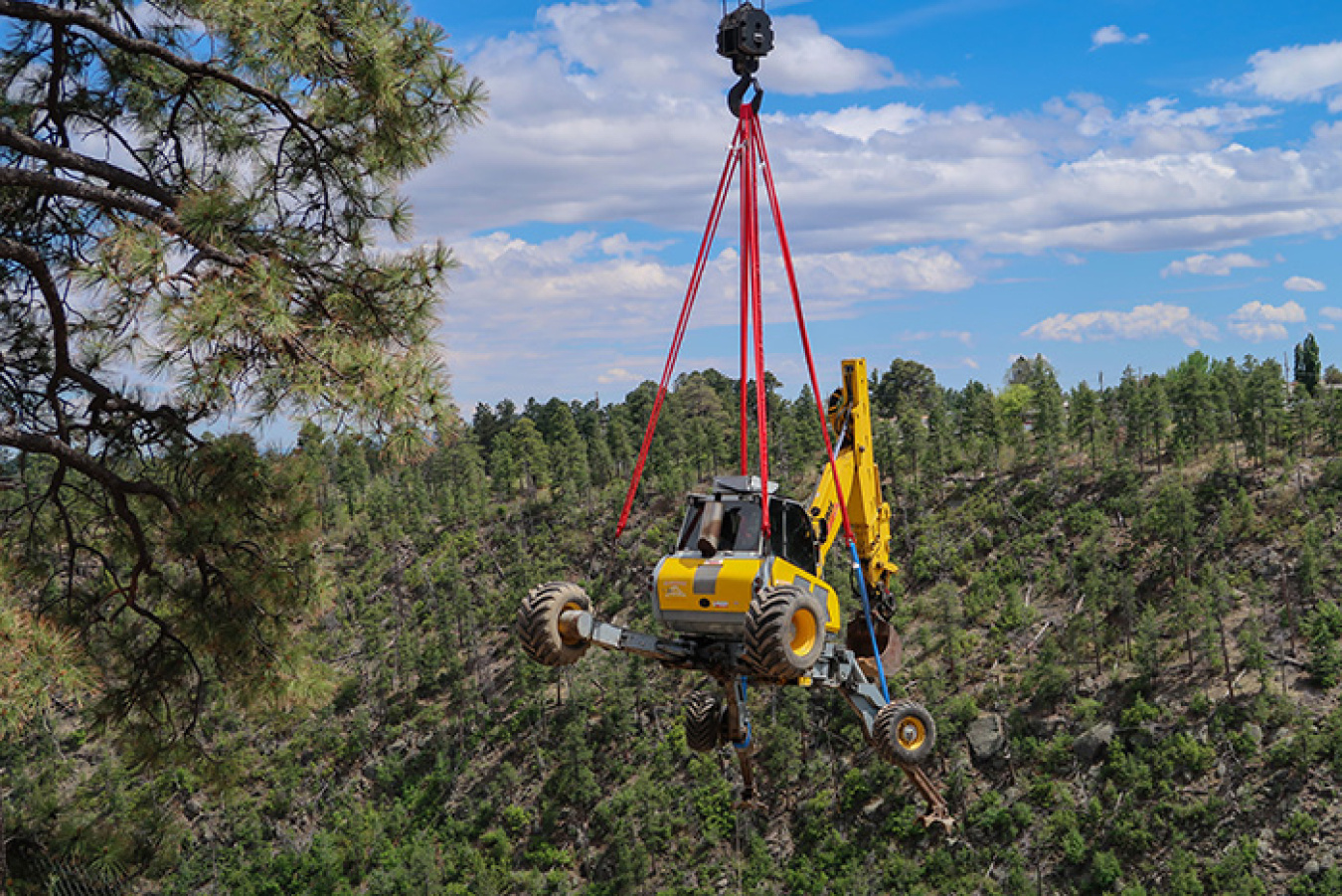 A crane was used to place a spider excavator on the canyonside during the 2017 cleanup work.