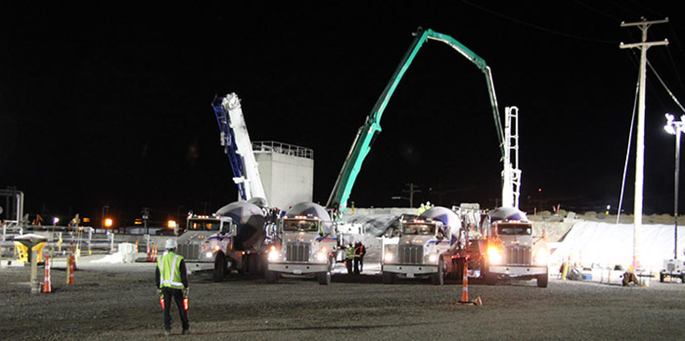 Trucks deliver engineered grout for placement inside a partially collapsed waste storage tunnel at the Hanford Site.