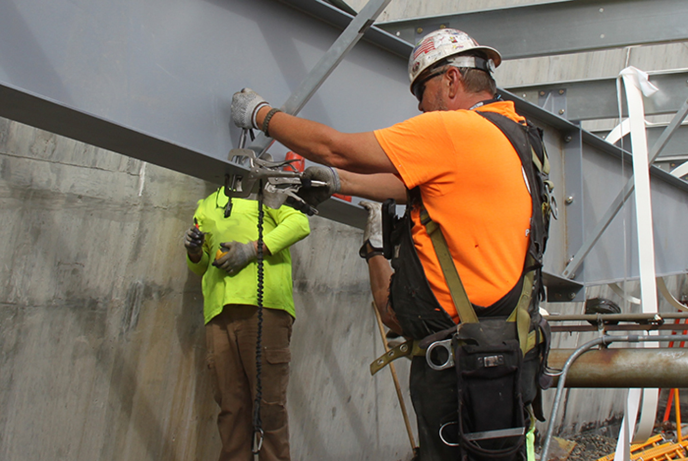Workers finish punch-list items for the roof repair at the Reduction Oxidation Plant (REDOX).  