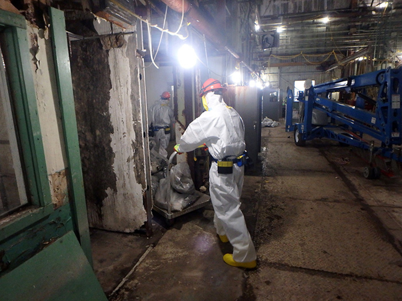 Crews remove materials from Building 7500.