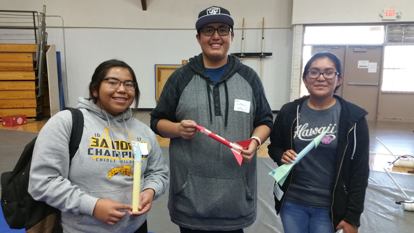 Students prepare to launch rockets they created during the festival.