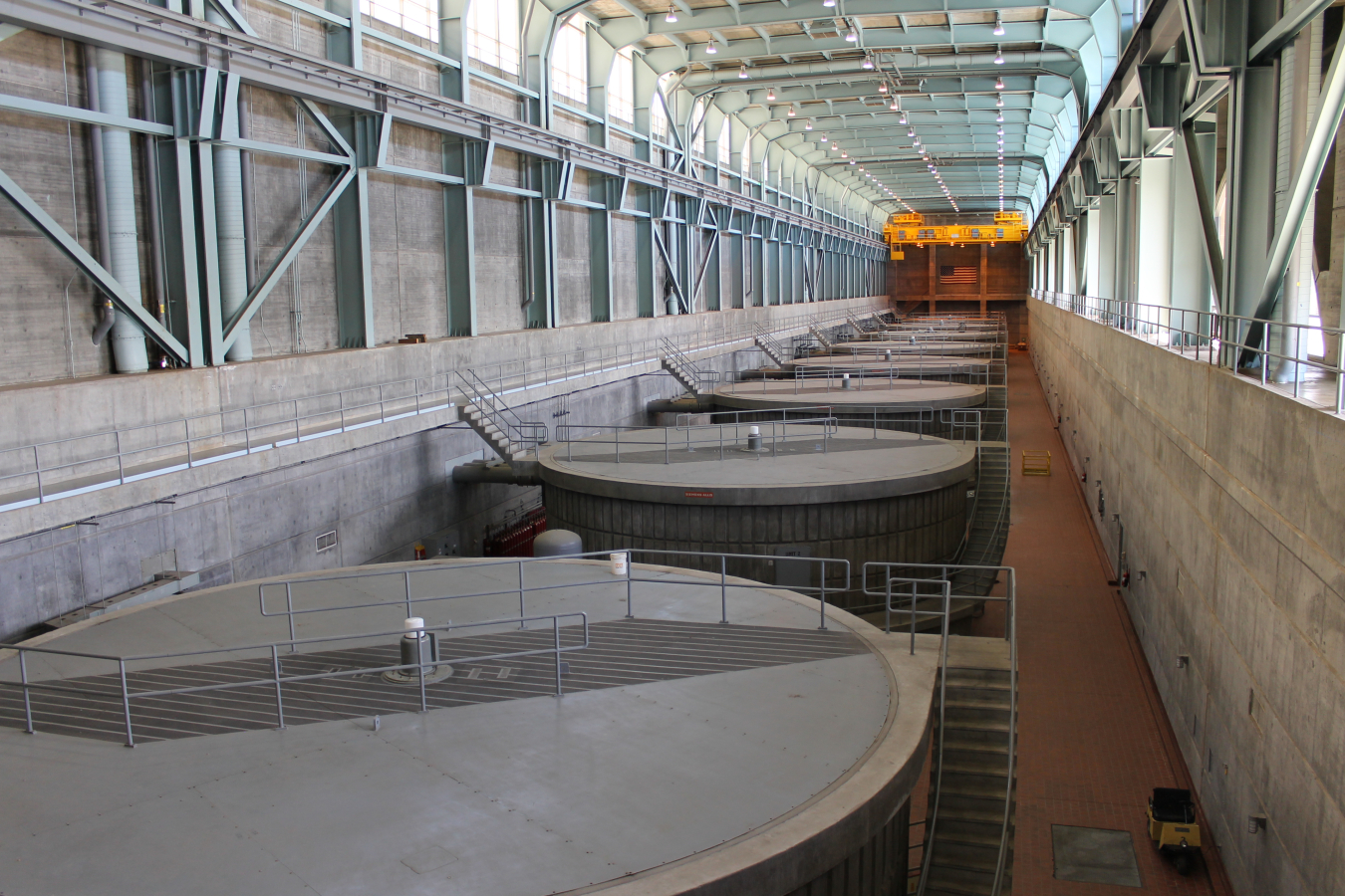 Photograph of hydroelectric generators in a row inside the dam