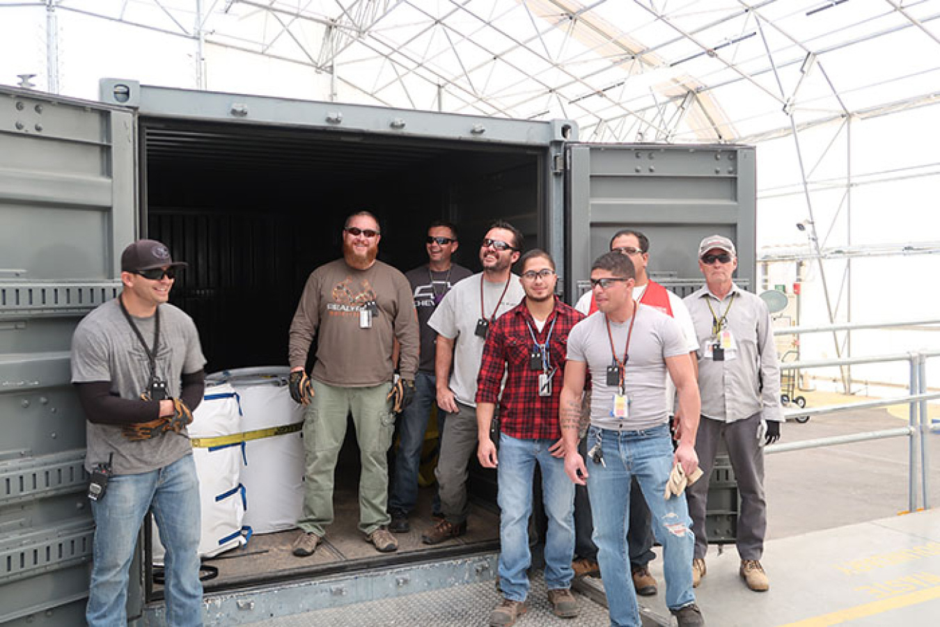 Team members celebrated the final shipment of RNS drums to WCRRF.