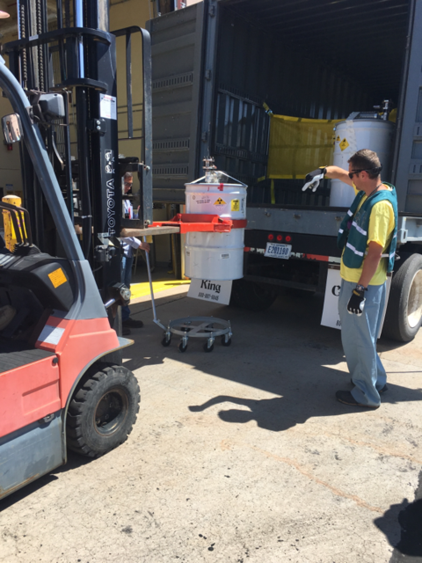 Workers carefully transported the RNS drums from the climate-controlled steel enclosure in Area G to WCRRF.