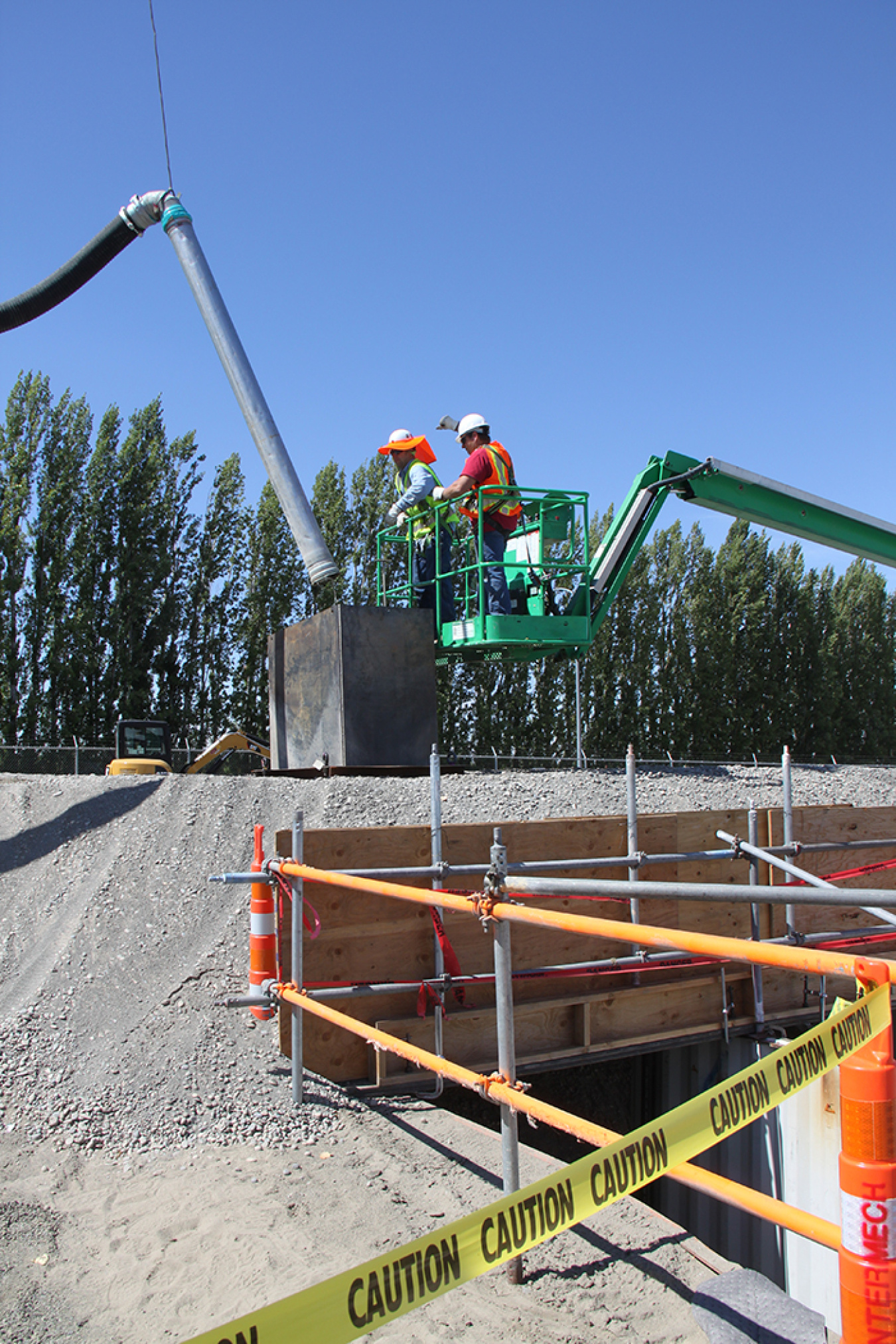 Workers practiced placing equipment before the actual grouting began at a mockup of the Plutonium Uranium Extraction Plant waste storage tunnel.