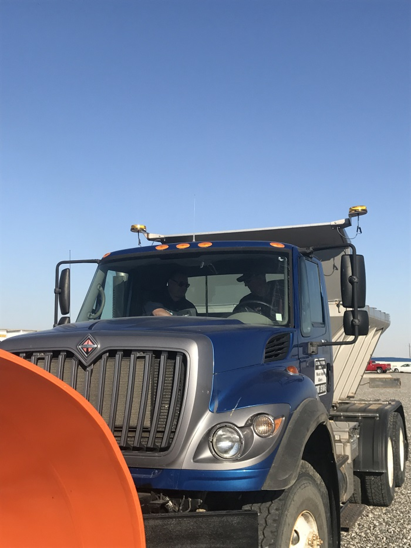 Mission Support Alliance Teamster Curt Cleveland (right) receives instruction on the in-cab control system from manufacturer trainer Adam Cornell.
