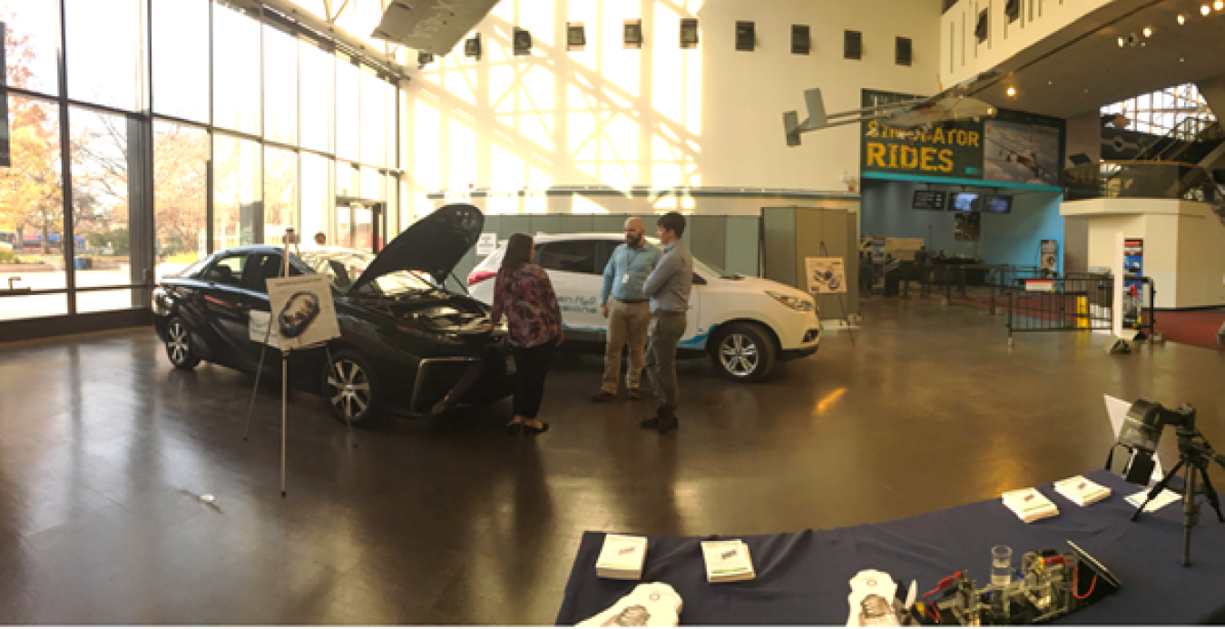 Two fuel cell electric vehicles on display inside the Smithsonian National Air and Space Museum