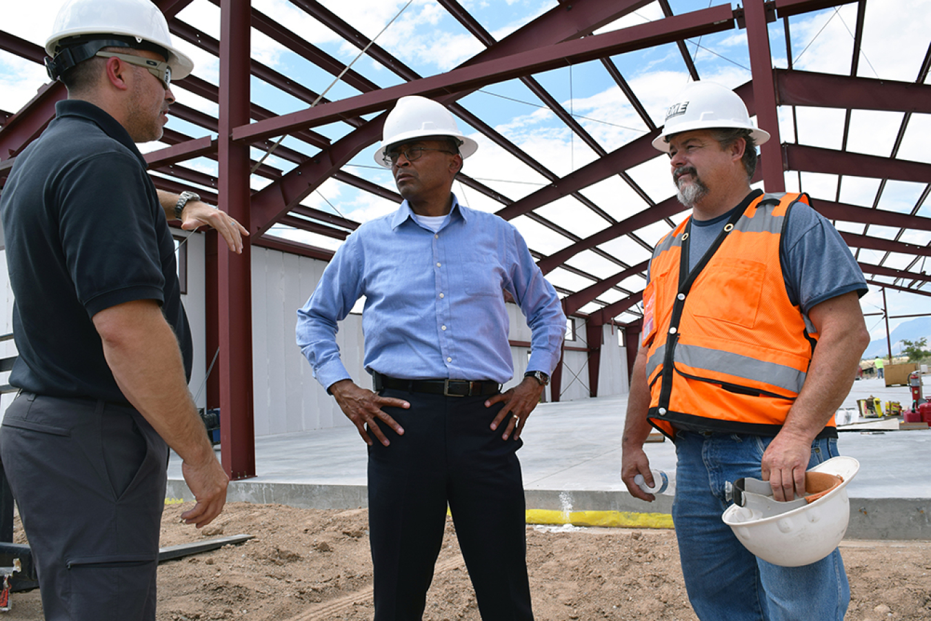 Office of Secure Transportation (OST) Western Command Director Timothy Oswald, left, and OST Assistant Deputy Administrator Vince Fisher, center, at a future training facility being built in New Mexico.