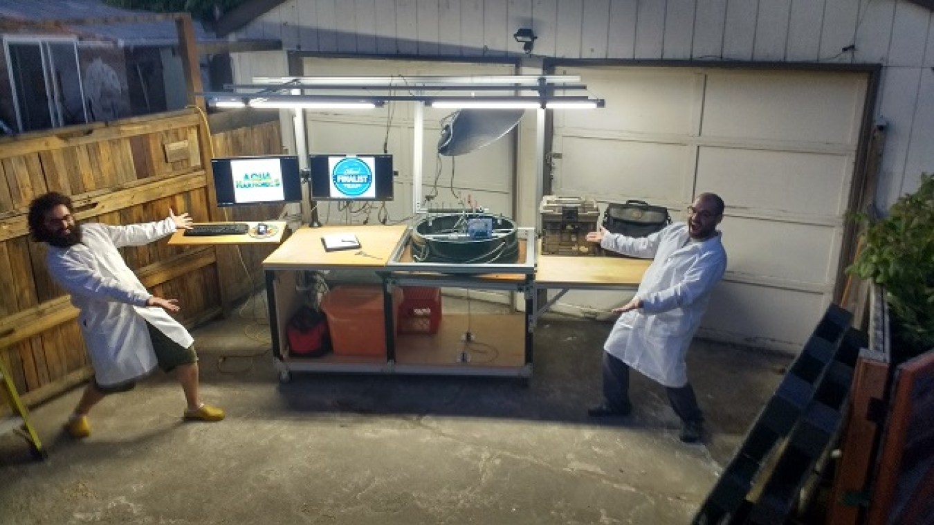 AquaHarmonics in lab coats at a workbench