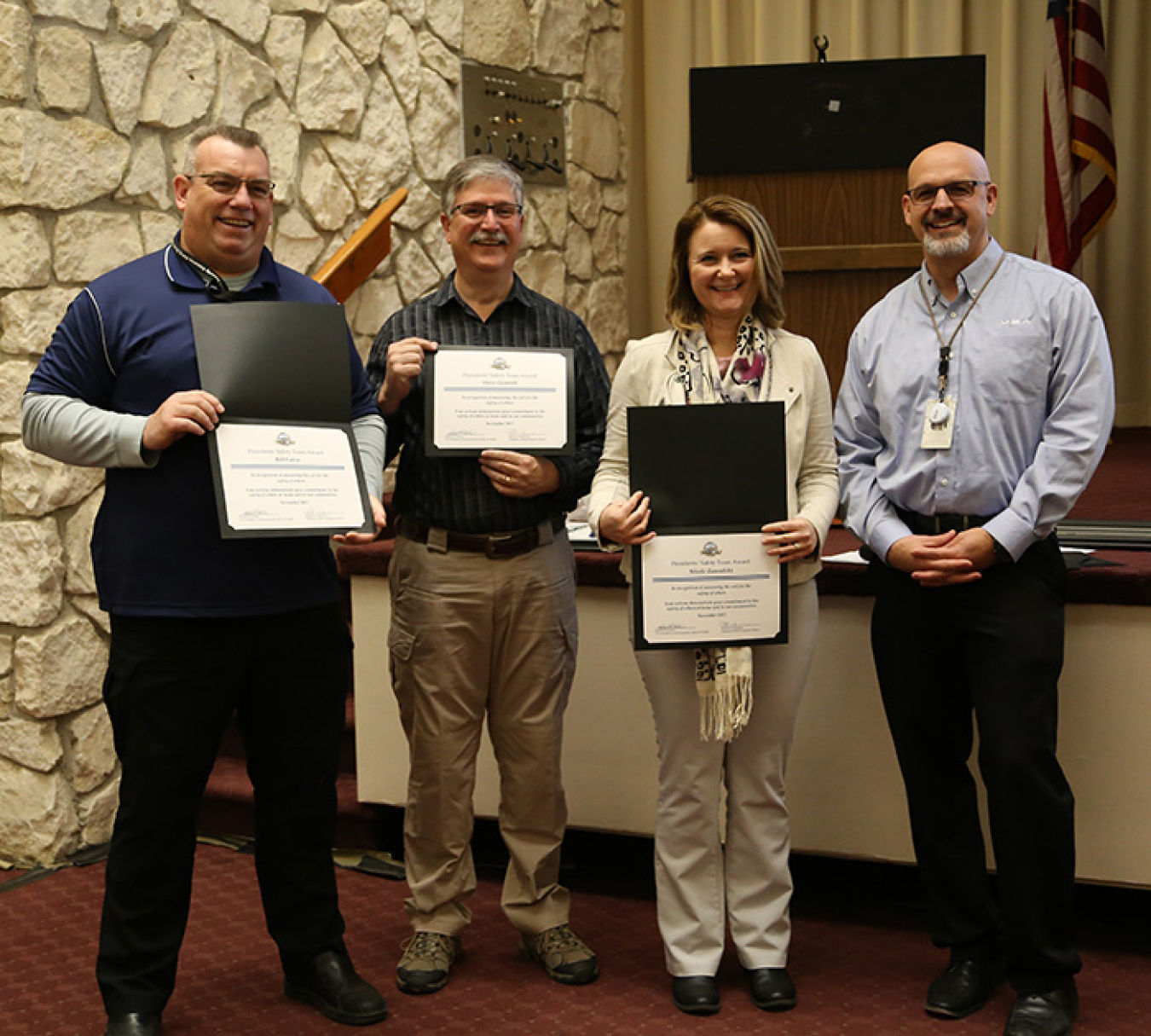 Bill Eaton, Steve Gunnink, and Nicole Zawadzki — part of the DOE Emergency Support Function #12 energy response team — accept the Mission Support Alliance (MSA) President’s Safety Award from MSA President Bob Wilkinson (far right).