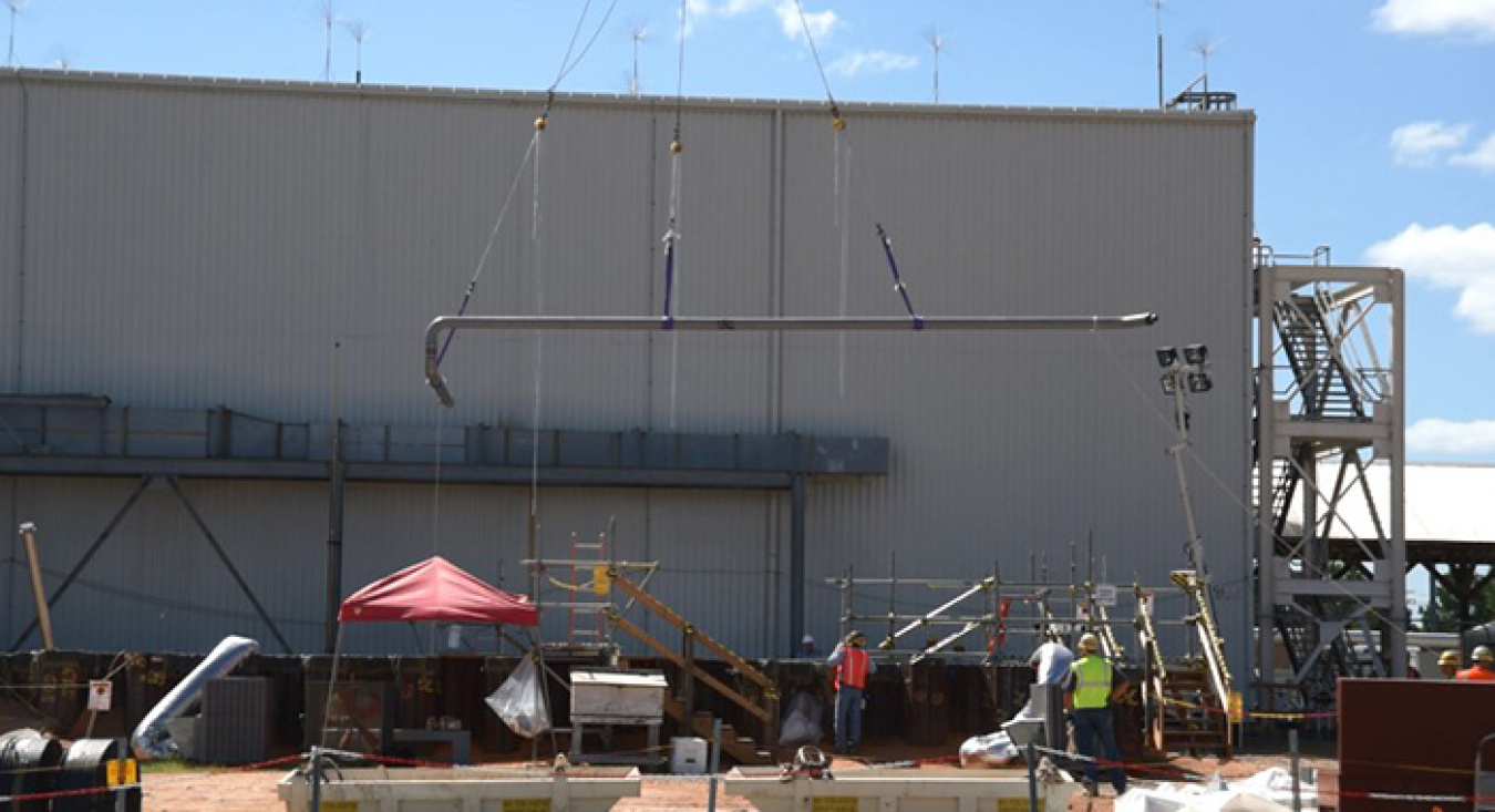 Crews install new strip effluent line in the 511-S excavation.