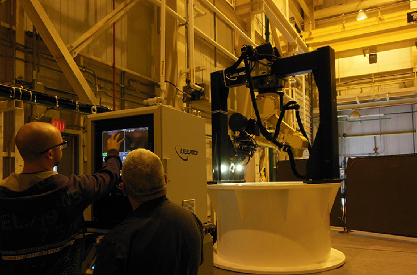 West Valley Demonstration Project operators train with the automated welding system.