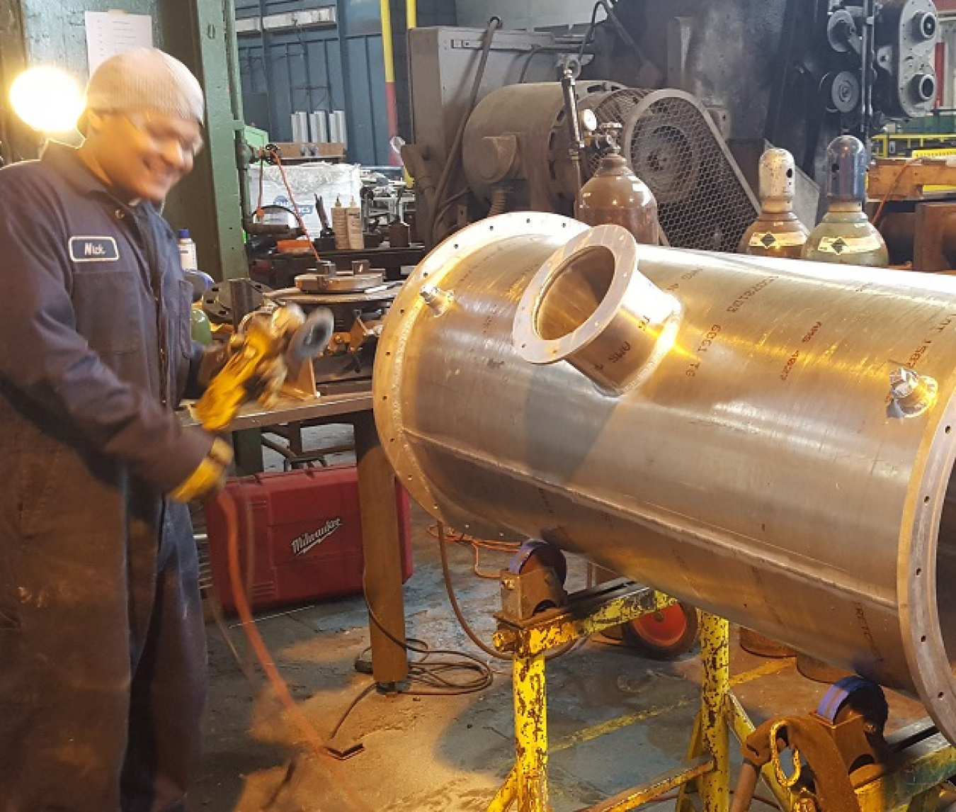 Photo 1 shows Johansing Iron Works welder Nick grinding out the final welds on on our device core