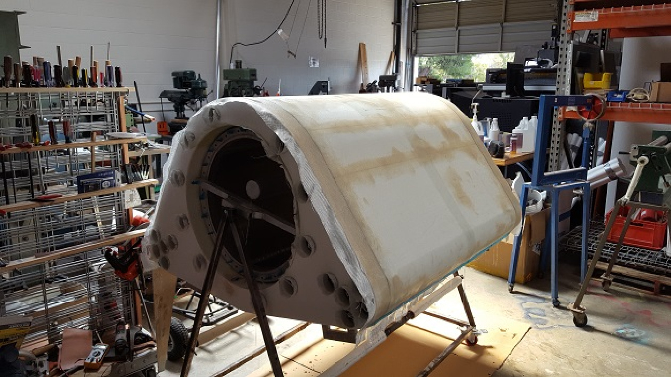 Assembly being fiberglassed - inverted on our custom build frame/test cart.