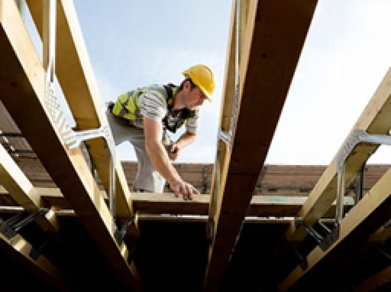 Photo of a man working on a house. Figure 1: Photo Courtesy of Meritage Homes.