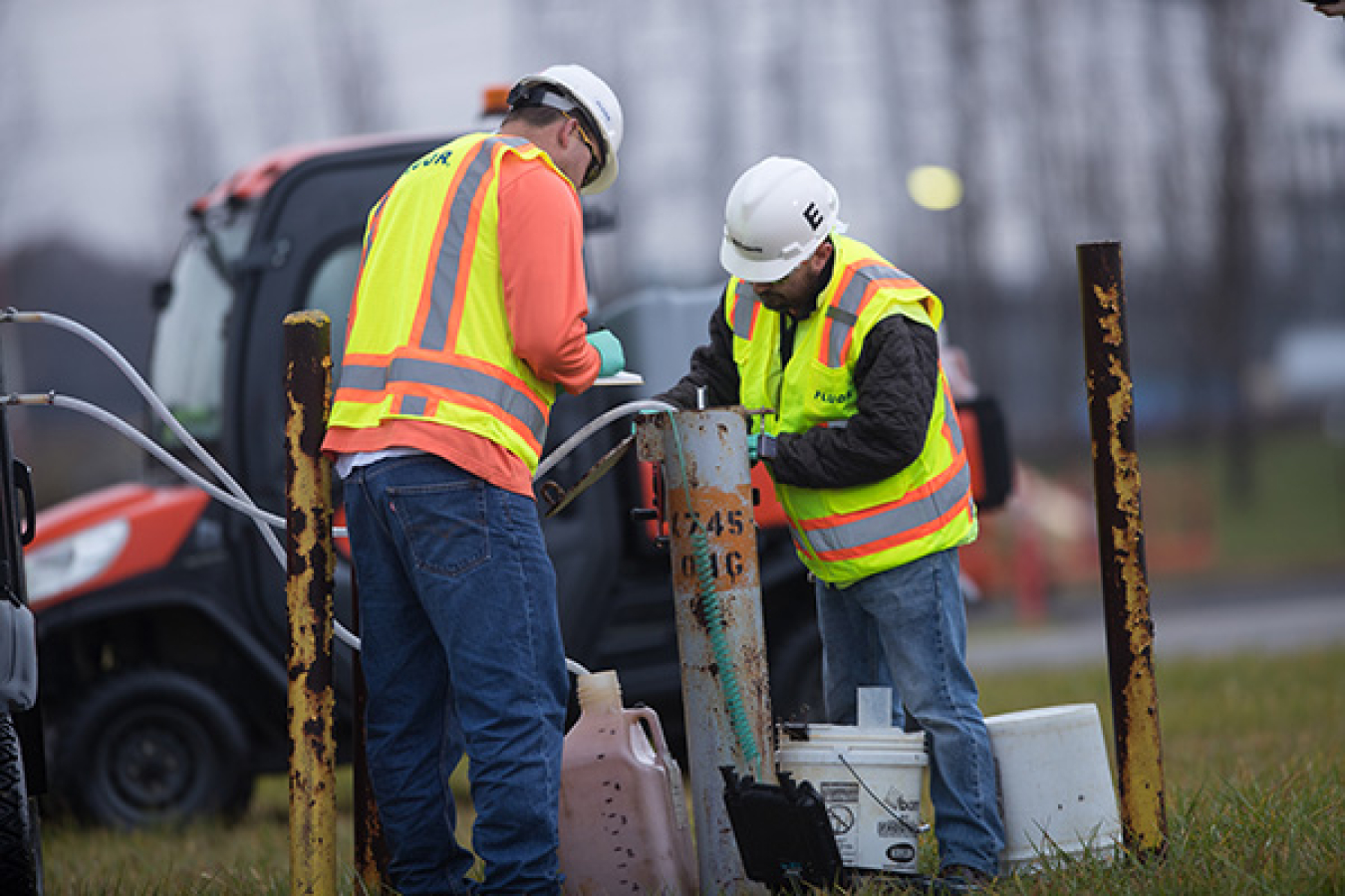 Workers monitoring groundwater