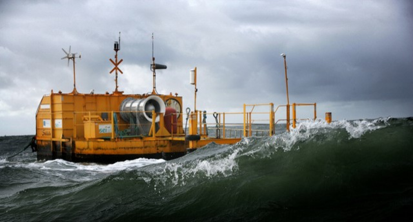 A yellow oscillating water column in turbulent waters.