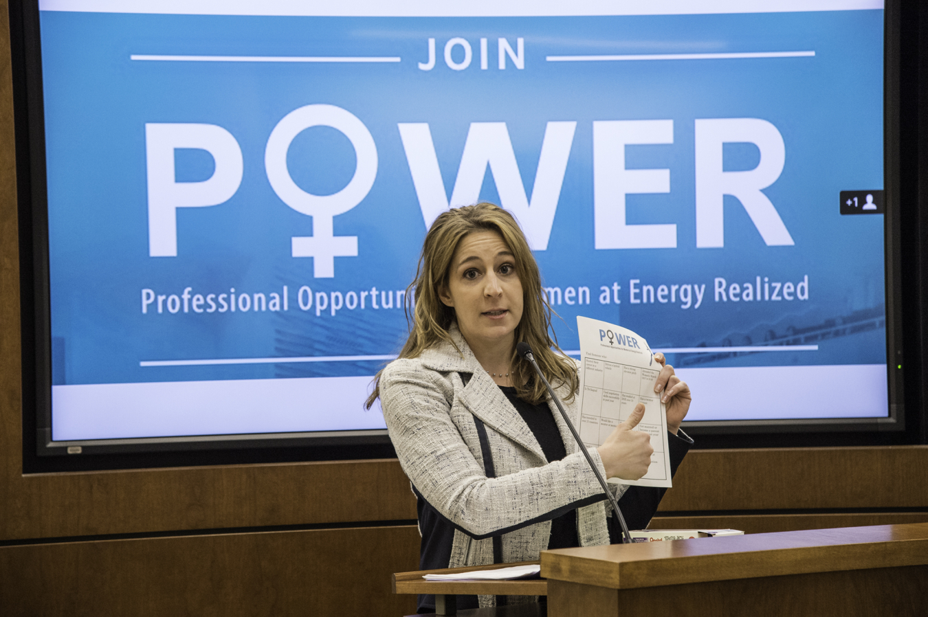 Brandi Martin, a member of the POWER Steering Committee, leads an icebreaker activity at the start of the meeting.