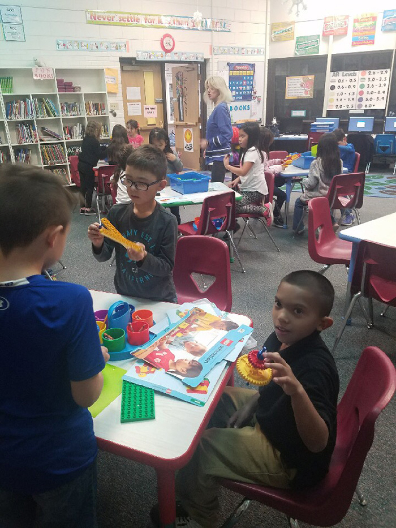 Students at Monterey Elementary School in Carlsbad assemble models during a science, technology, engineering, art, and mathematics (STEAM) activity.