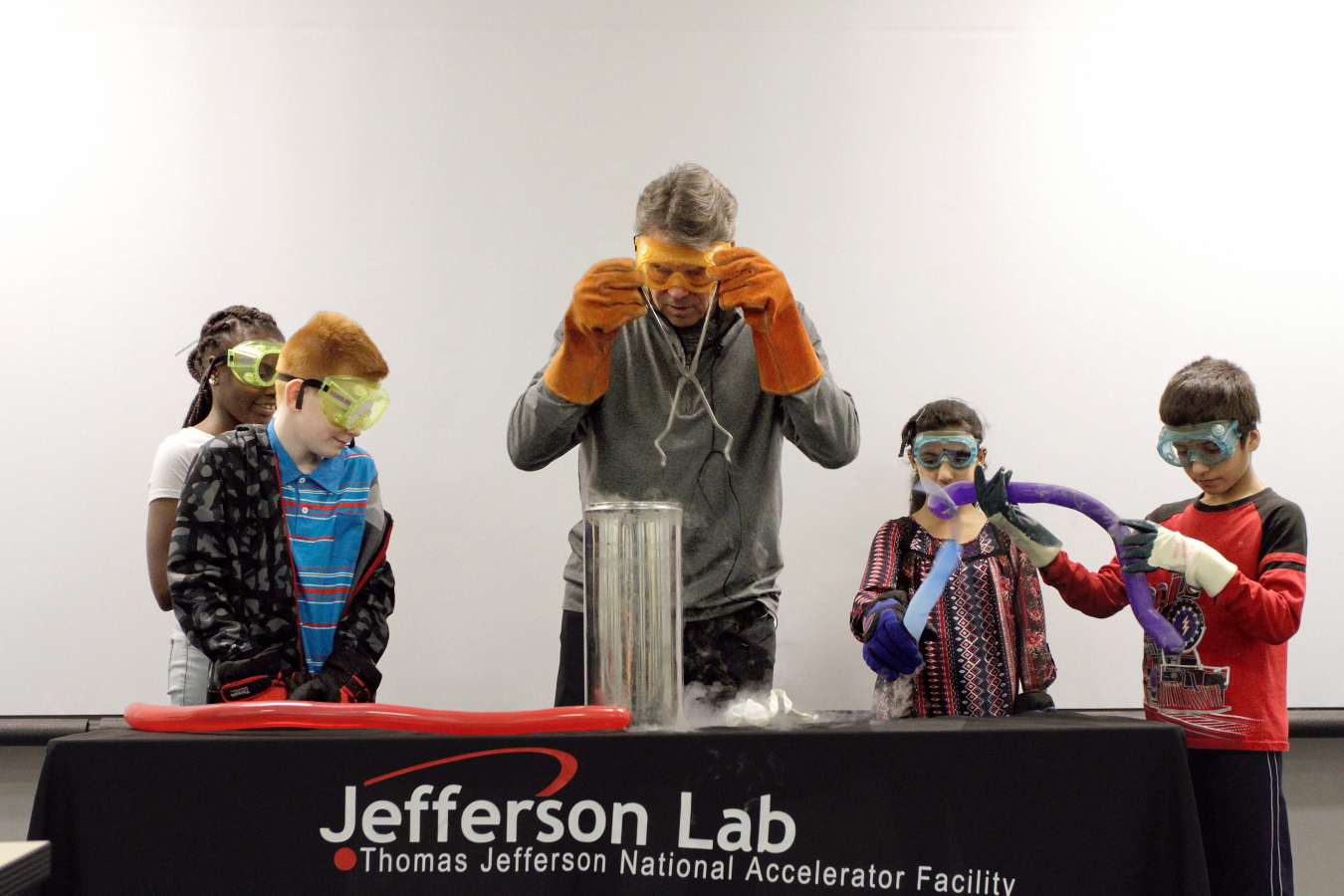 Secretary of Energy Rick Perry leads a BEAMS activity featuring liquid nitrogen. Secretary Perry and the Newport News, Va., 5th graders explored what happens to balloons and carnations when they've been cooled to -321 degrees Fahrenheit.