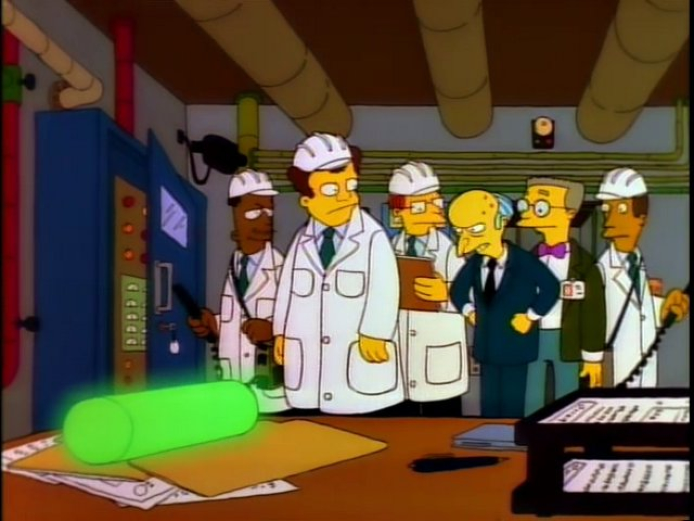 Simpsons characters look at plutonium used as a paper weight.