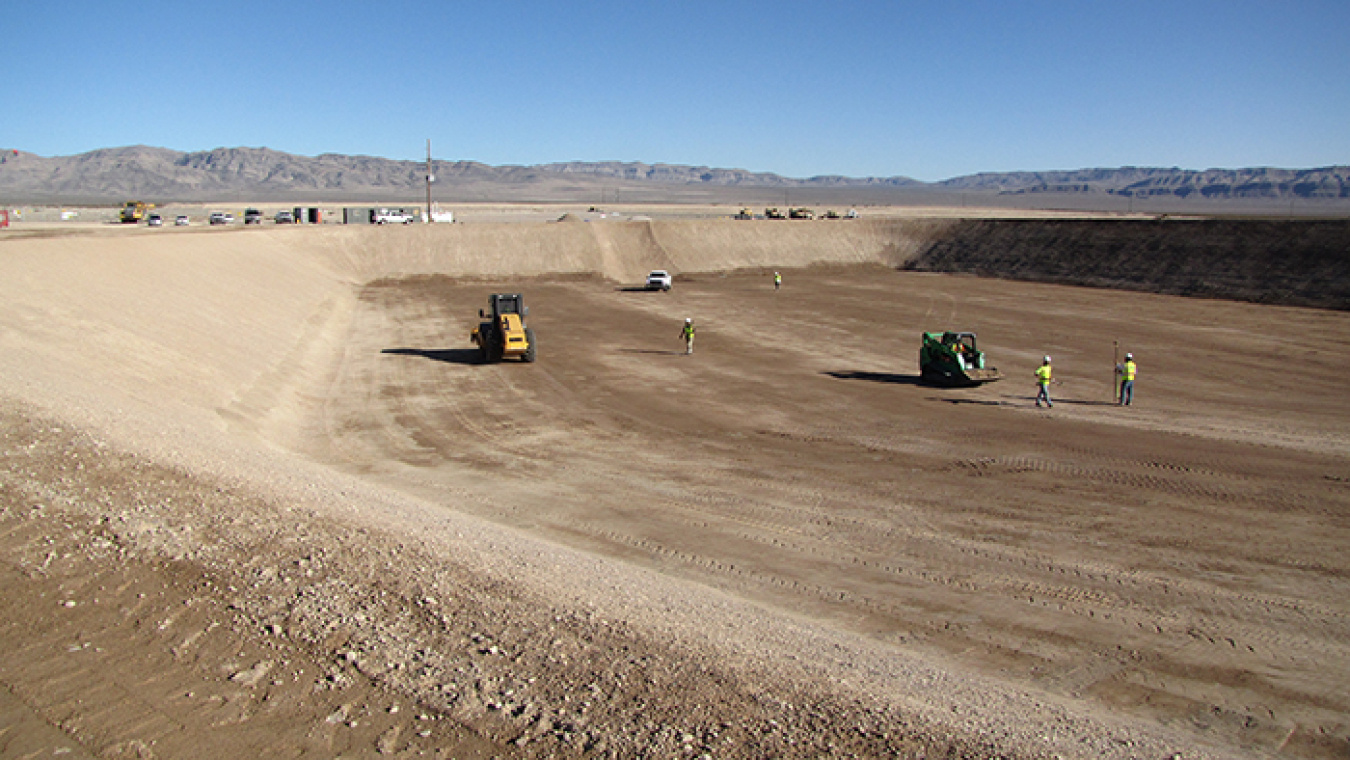 Crews used surveying equipment to fine-tune grading of the disposal cell.