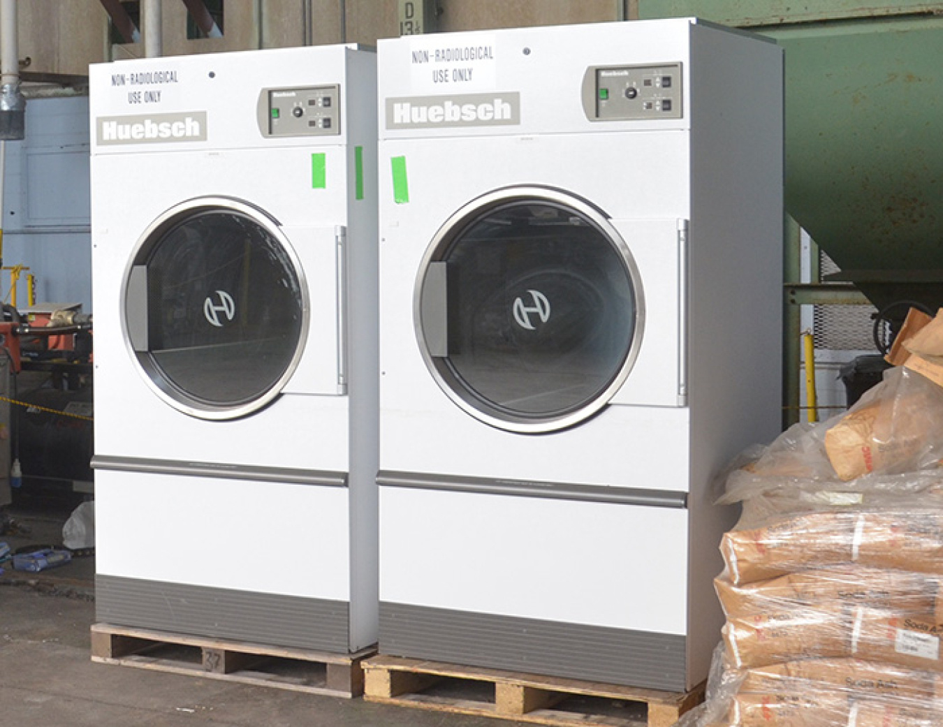 Shown are two of four excess government-owned commercial dryers to benefit clients of the Merryman House Domestic Crisis Center in Paducah.