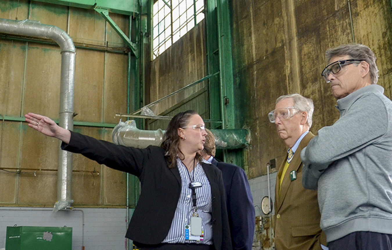 At the largest source of groundwater contamination at the Paducah Site, April Ladd of EM’s PPPO describes ongoing deactivation and remediation projects related to the C-400 Cleaning Building to Sen. Mitch McConnell (center) and Secretary Rick Perry.