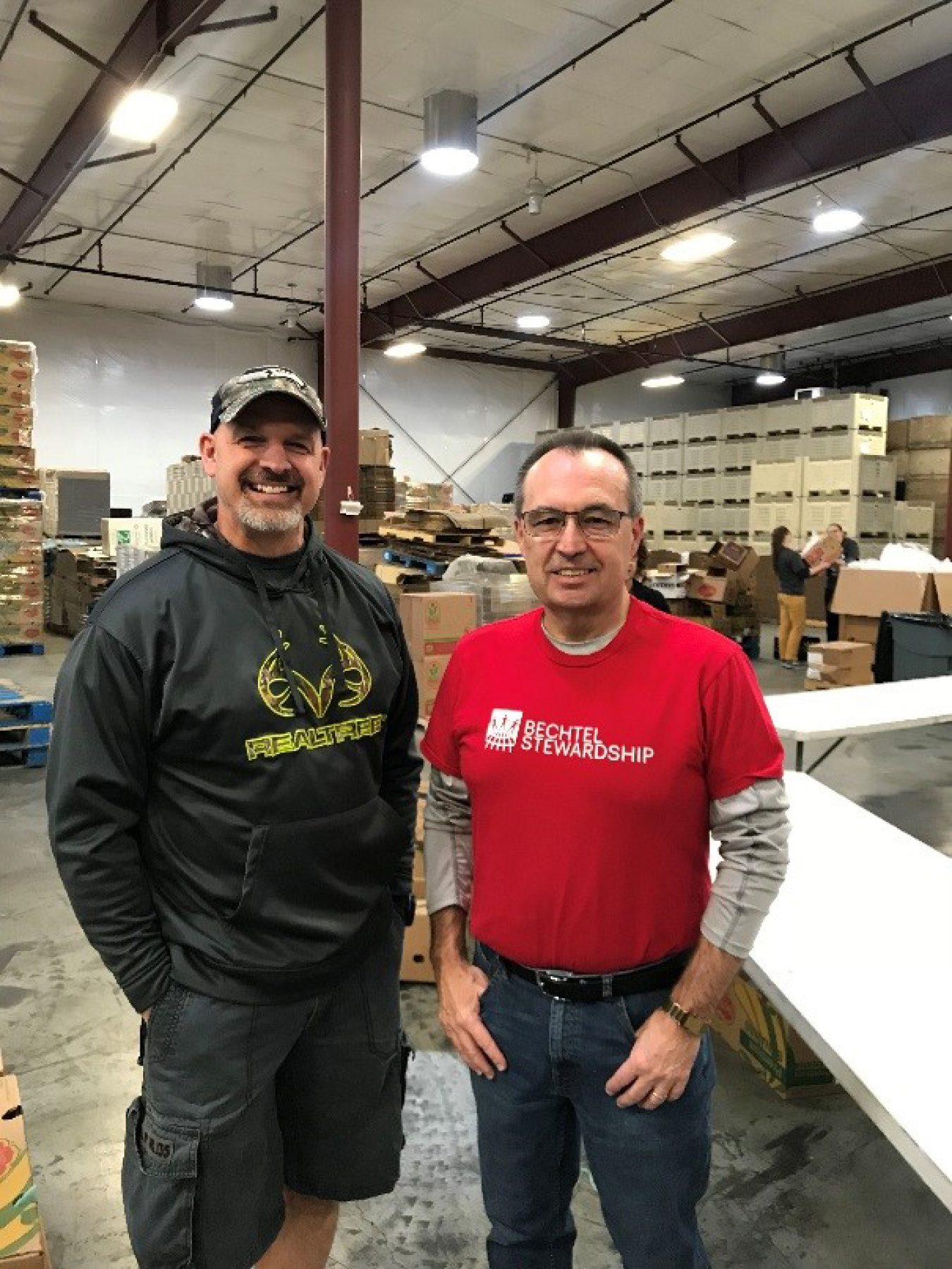 Mission Support Alliance President Bob Wilkinson, left, and Bechtel Waste Treatment and Immobilization Plant Project Director Brian Reilly helped pack more than 6,100 Bite2Go food kits.
