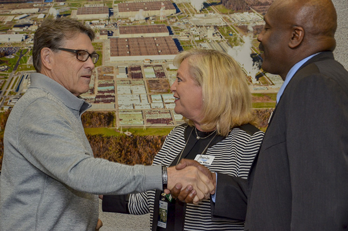 Paducah City Commissioner Sandra Wilson introduces Secretary Rick Perry to Dr. Anton Reece, president of West Kentucky Community and Technical College, during a community leaders meeting following a tour of the Paducah Site.