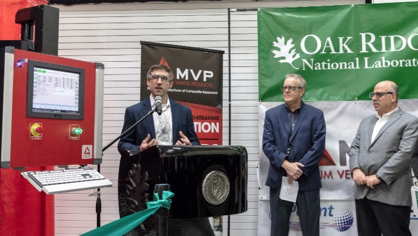 Blake Marshall, Manager, MDF, AMO speaks to attendees at the MVP thermoset printer ribbon-cutting (at right, Craig Blue, Director, ORNL, Energy Efficiency and Renewable Energy Programs and Moe Khaleel, ORNL Associate Laboratory Director, Energy and Enviro