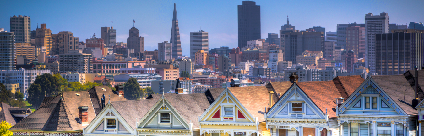 Photo of a city skyline in the daytime with lots of office buildings.