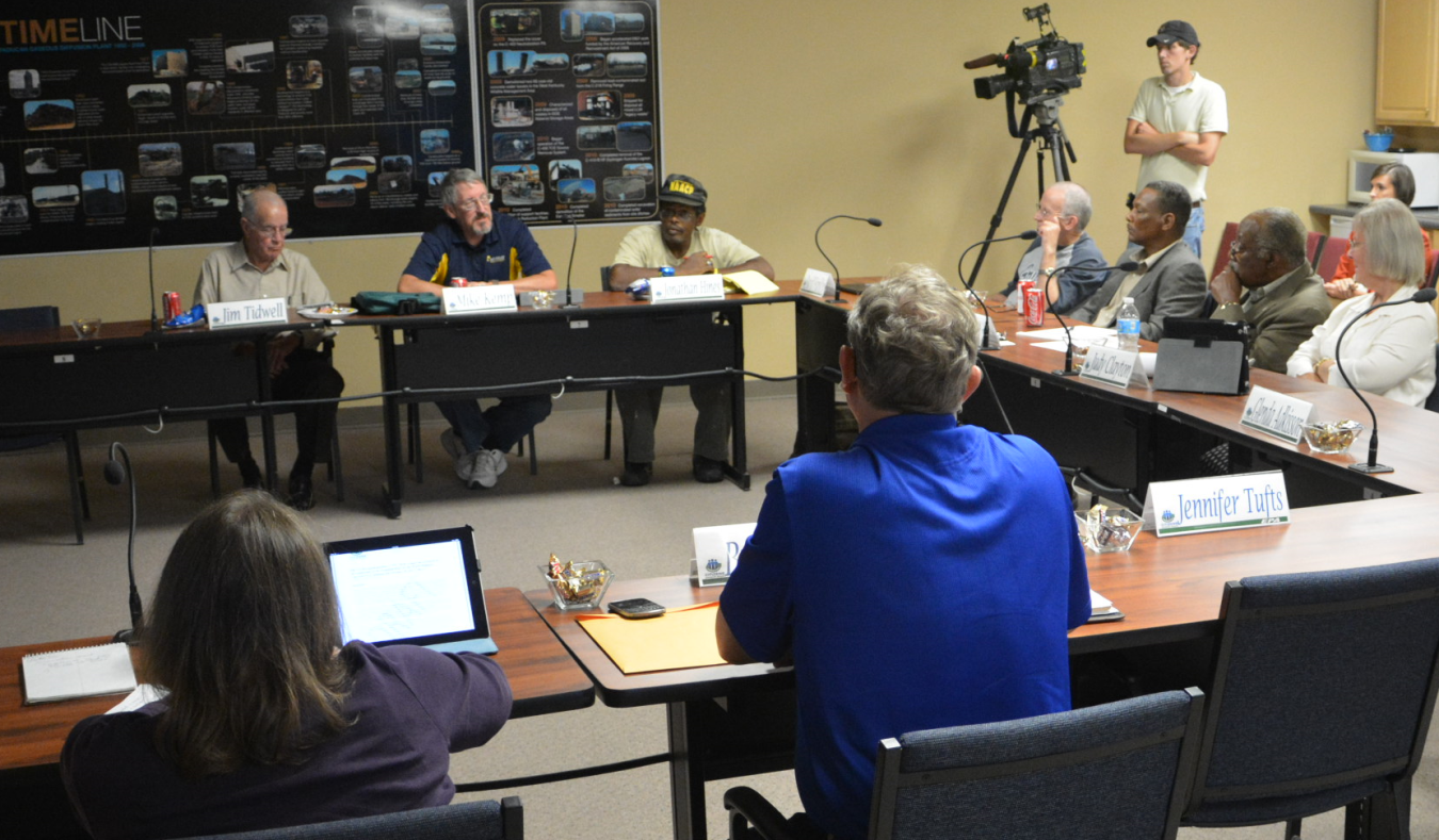 The CAB Board is shown during a 2013 meeting discussion.